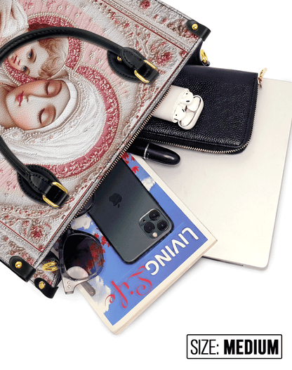  Sacred Serenity: The Madonna’s Tender Embrace Leather Bag